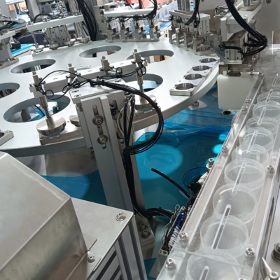 Automated urine cup assembly machine, compatible with feeding elevators and connectable to injection moulding machines, enhances product assembly efficiency and reduces labour requirements.